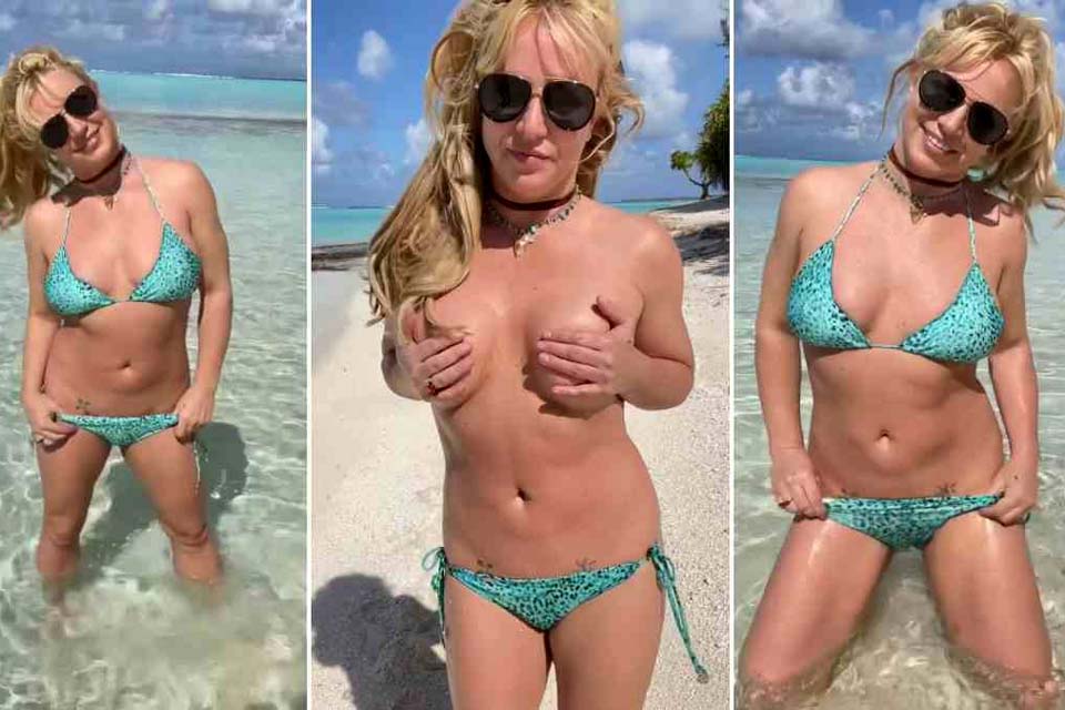 Britney Spears faz topless em praia durante lua de mel com o marido